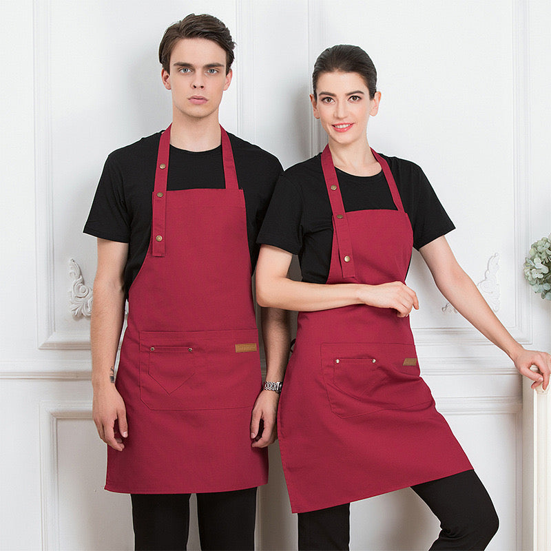 A Men and Women is Wearing Red Unisex Adjustable Kitchen Chef Apron.