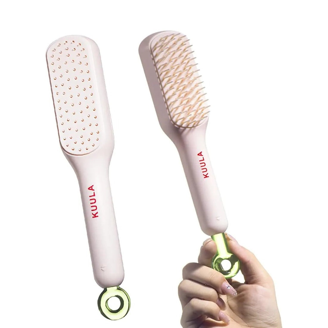 A Person is Holding Retractable Self Cleaning Hair Brush.