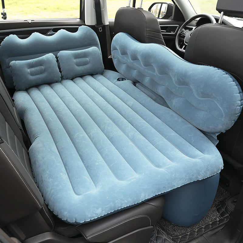 Blue Portable Travel Inflatable Car Bed placed in a car