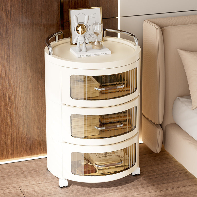 Round Rolling Storage Cabinet Organized with Books and Home Decor.