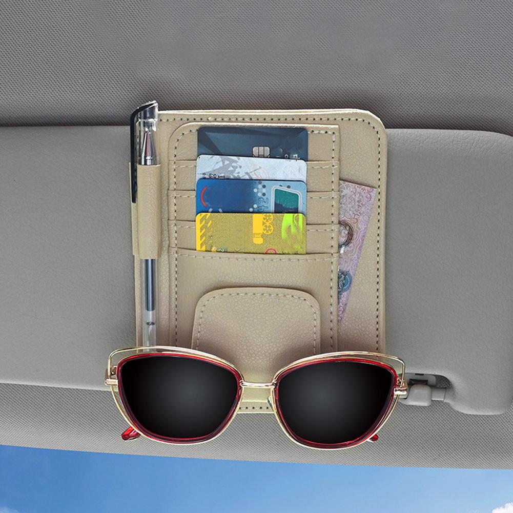 Leather Car Sun Visor Organizer with items in it