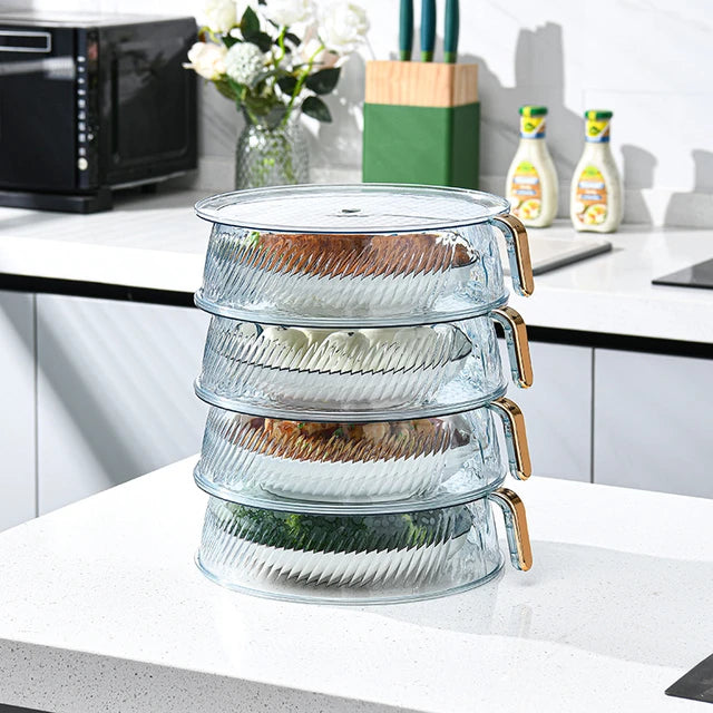 Four plastic food storage containers with handles, stackable for easy storage. Ideal for keeping fruits and vegetables fresh
