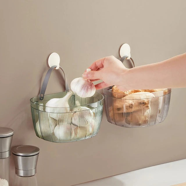 a person Taking garlic from Household Storage Organizer Basket