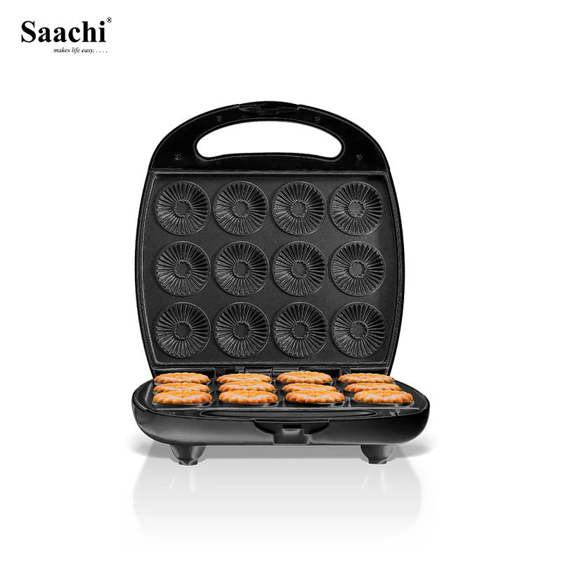 A Saachi electric Biscuit maker with twelve circular molds, shown open with freshly baked Biscuit inside, placed on a white surface.