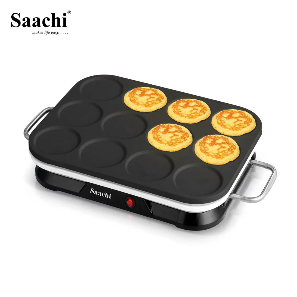 A Saachi electric mini pancake maker with a non-stick cooking surface and stainless steel side handles, used for making multiple pancakes simultaneously.