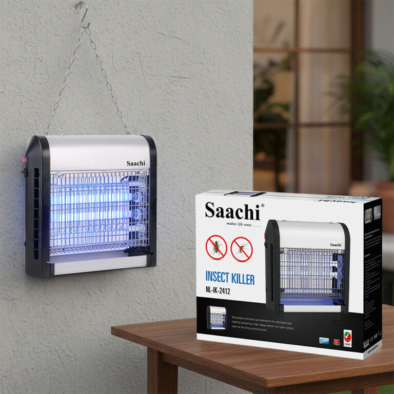 Saachi insect killer on a wall next to its packaging box on a table.