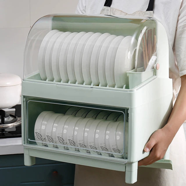Someone holding Double-layer Dish Drain Tableware Storage Rack with some plates