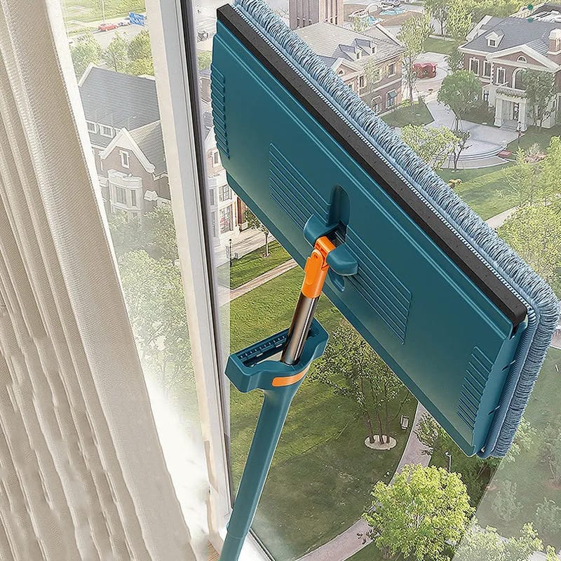 Cleaning Window Glass Using Self Squeezing Micro Fiber Flat Mop With Bucket.