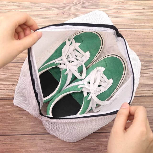 The inside of the Reusable Shoes Sneakers Washing Mesh Laundry Bag with Zip Closure, featuring shoes