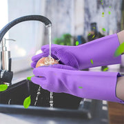 A Person is Cleaning Apple by Wearing Silicone Hand Gloves with Scrubbing Bristles.