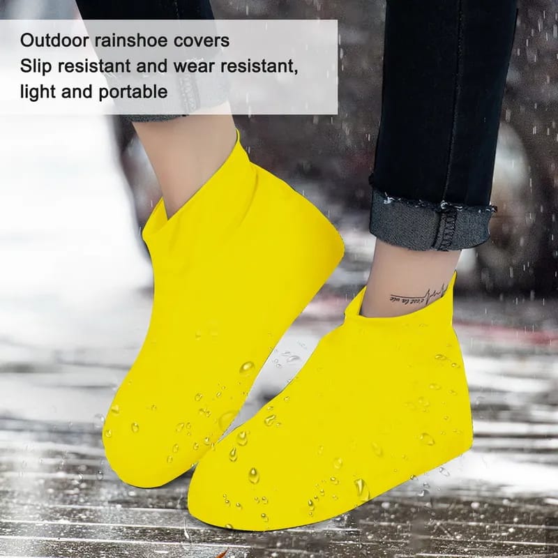 A Person is Protected his Shoe by Wearing Silicone Waterproof Shoe Cover.