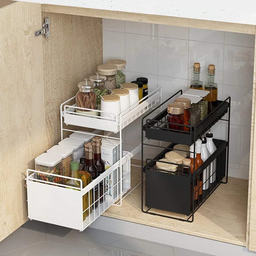 Black and white Under Sink Storage Rack with food and drinks neatly placed in the cupboard