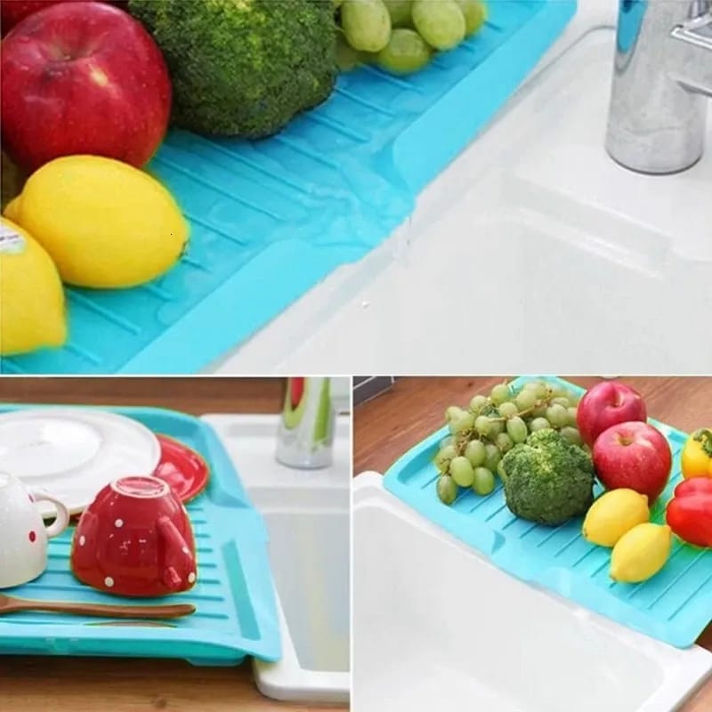 Utensils And Fruits Are Placed On The Sink Dish Drainer Tray Rack.