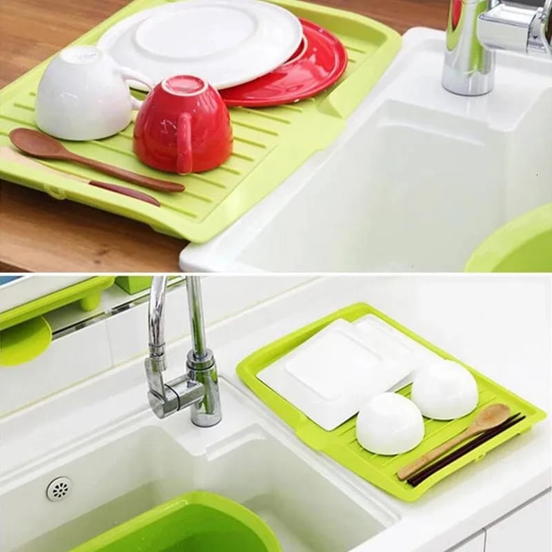 Utensils Are Placed On The Sink Dish Drainer Tray Rack.