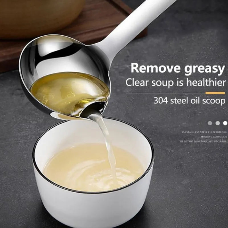 Someone pouring soup into a cup with the help of a Stainless Steel Oil Separating Skimmer Spoon