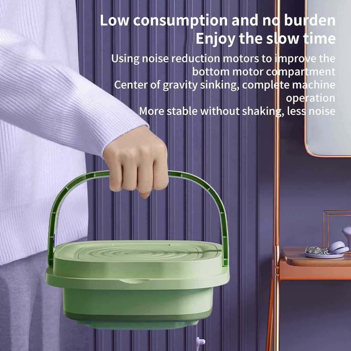 Green Smart Folding Mini Portable Washing Machine held by a hand with promotional text about noise reduction motors.