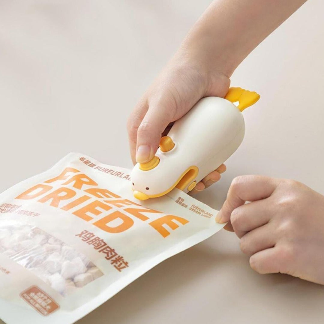 A Person is Sealing a Snack Bag Using Snack Bag Sealer Machine.