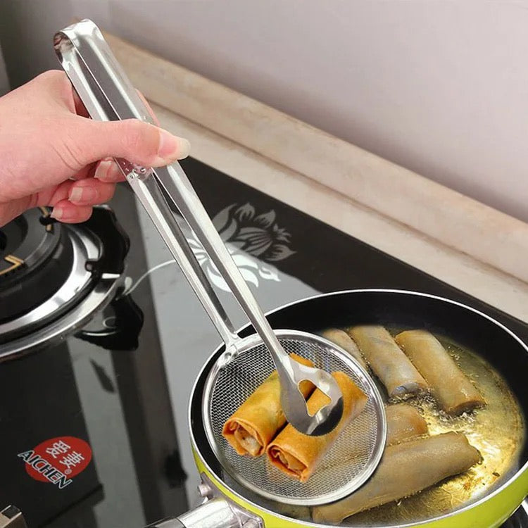 A Person is Frying Snacks Using Stainless Steel Strainer.