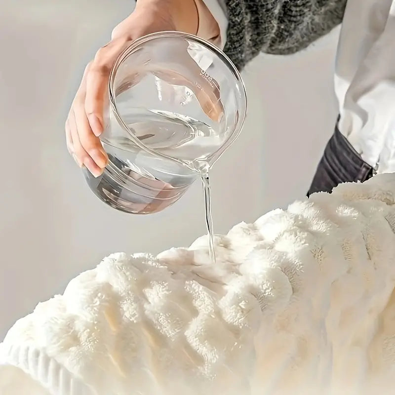 A Person Pouring Water in to Soft Coral Fleece Bath Towels.
