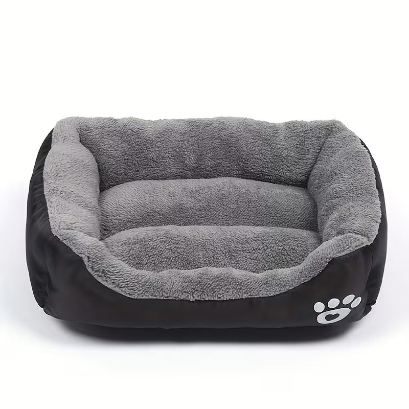 Pet bed with gray interior and black exterior on a white background