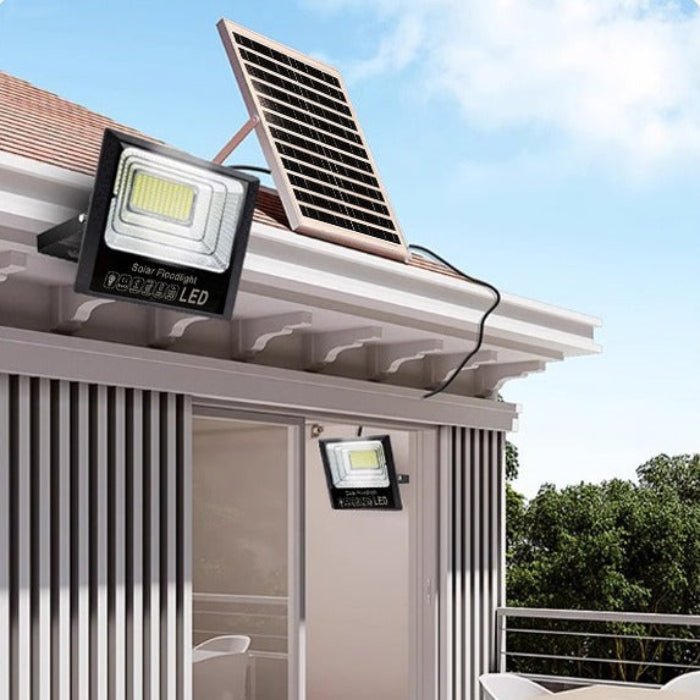 Solar Floodlight setup on a house, featuring two floodlights and a rooftop solar panel.