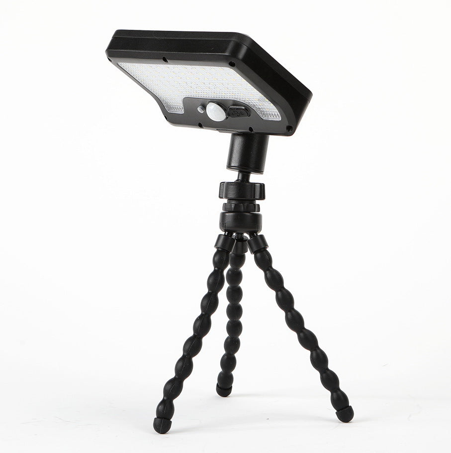 A Solar Motion Sensor Light is attached to flexible tripod stand