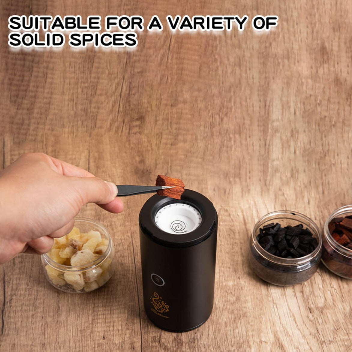 A Person is Placing a Solid Spice Inside Electric Mini Incense Bukhoor Burner.