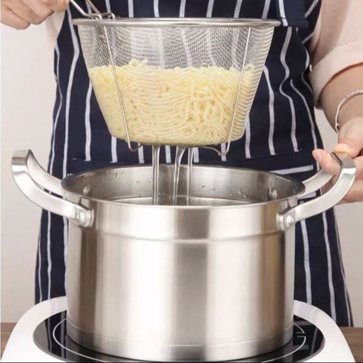 A person using a Stainless steel Deep Fry Basket for draining boiled pasta over a pot