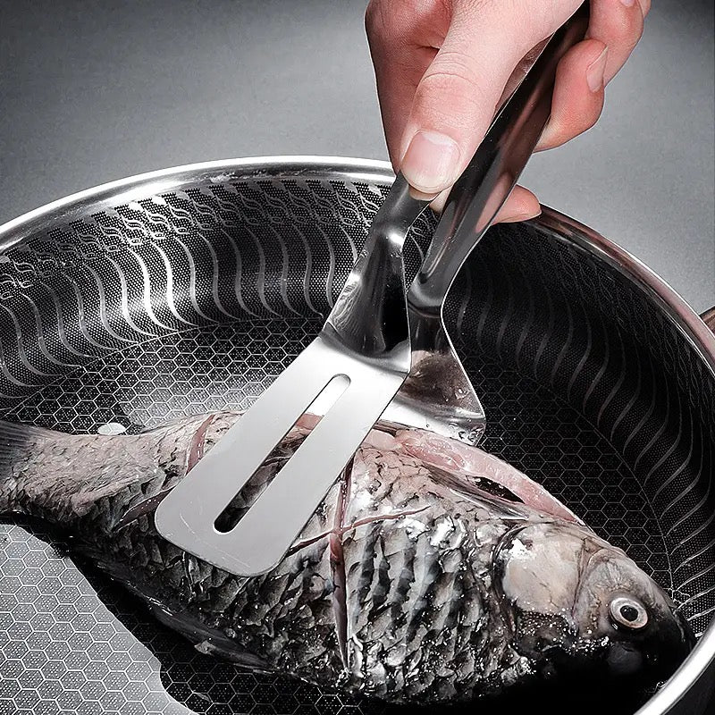 Someone holding fish with the help of Stainless Steel Food Tongs