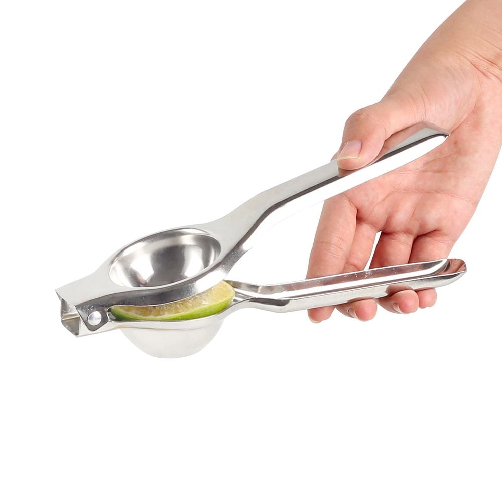 A Person is Squeezing Lemon Using Stainless Steel Lemon Squeezer.