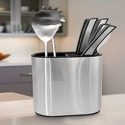 Stainless Steel Sink Storage Rack organized with knives and cutleries are placed on a kitchen countertop.