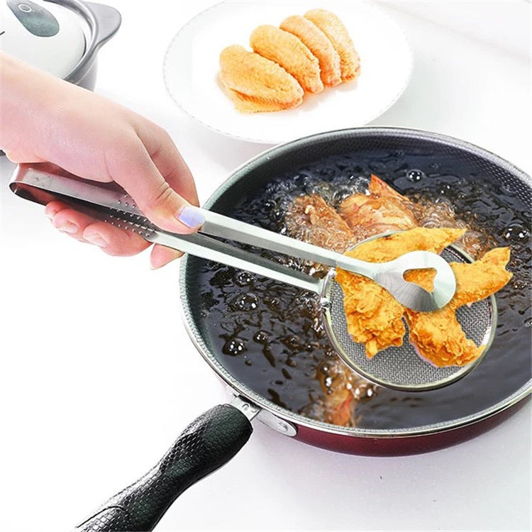 A Person is Frying Chicken Using Stainless Steel Strainer.