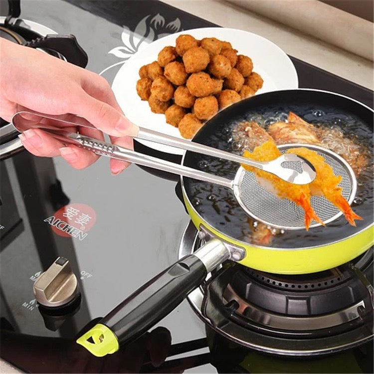 A Person is Frying Shrimp Using Stainless Steel Strainer.