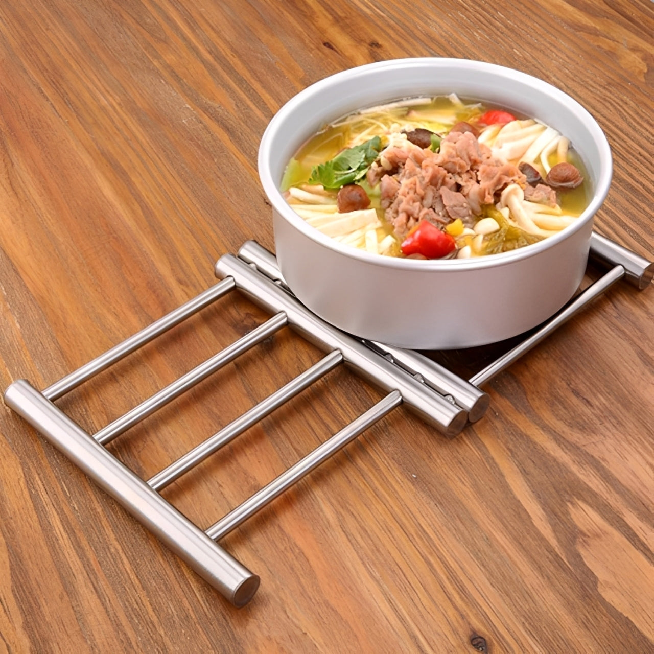 A Hot Pot with Food is Placed on the Stainless Steel Trivet Pot Pad.