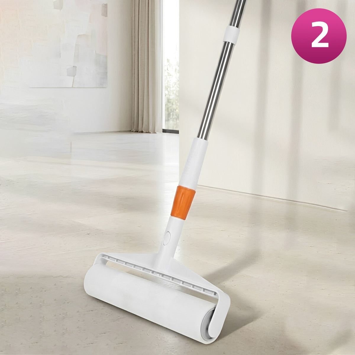 A Sticky Mop with an orange accent on the handle, shown on a light-colored floor in a bright room. A pink circular badge with the number 2 is in the top right corner.