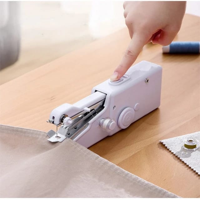 a person pressing the switch on an Electric Handheld Sewing Machine