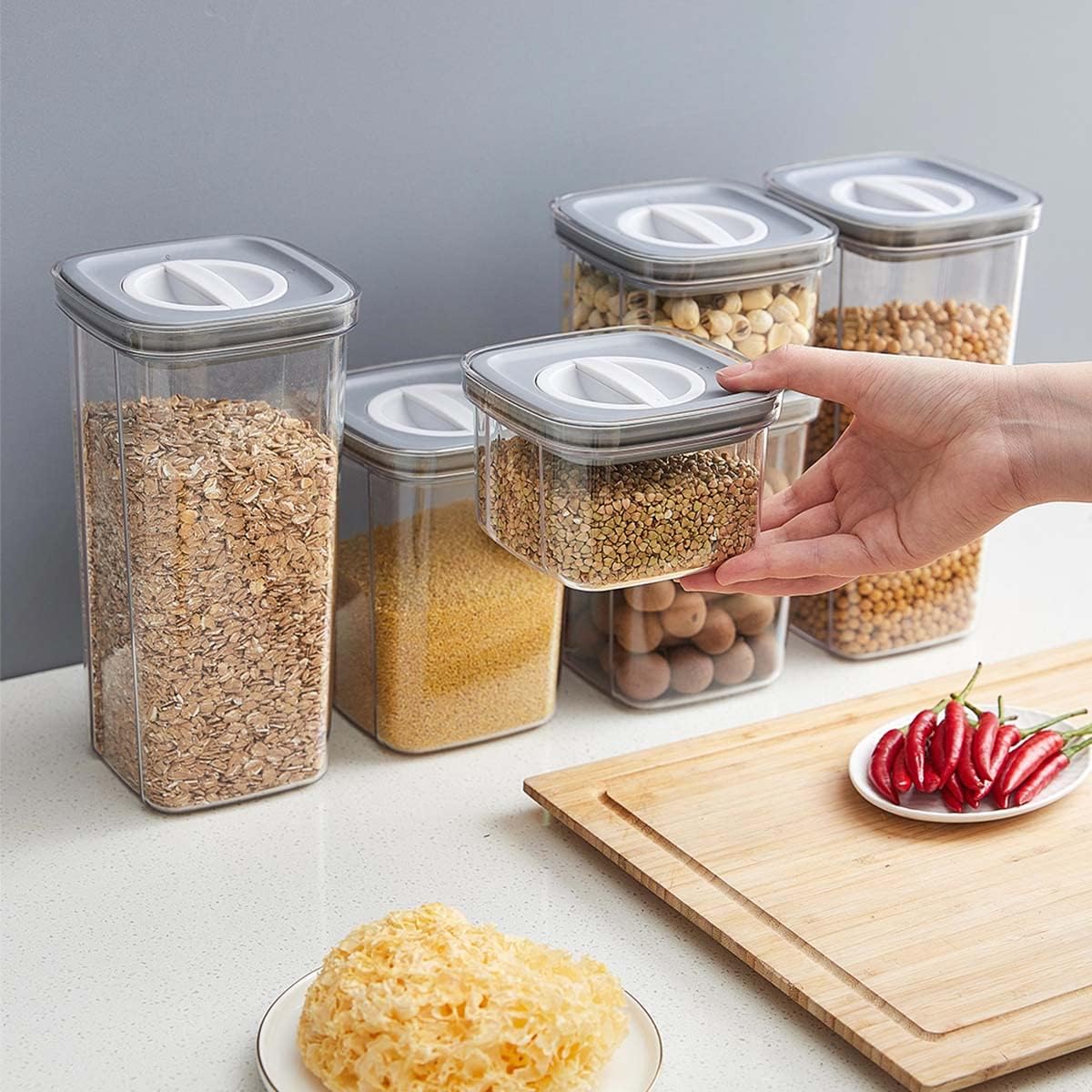 3Pcs Set Airtight Cereal Storage Containers next to some items