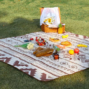 A Stylish Camping Mat is Placed in a Picnic area arranged with food items.