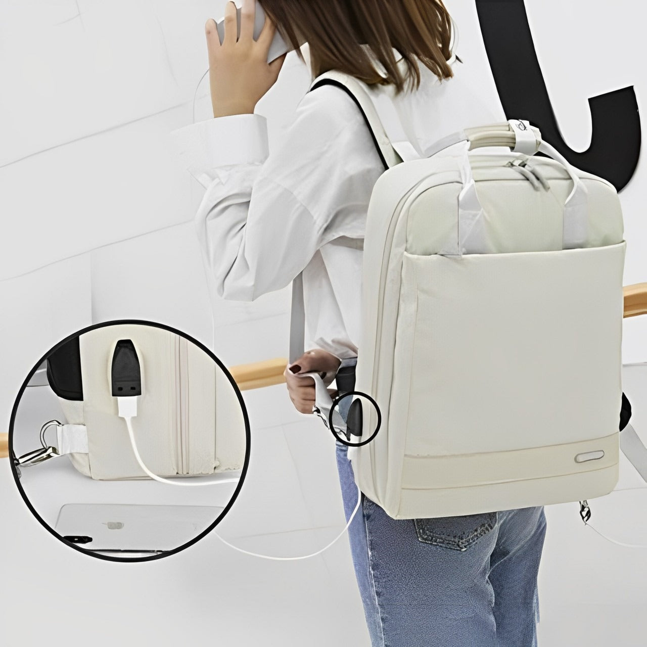 A Women is Holding Stylish  Laptop Backpack with USB Charging.