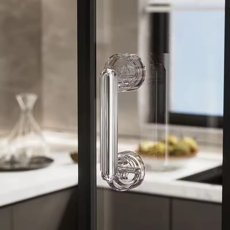 A Suction Cup Door Handle is Fixed On Glass Door.