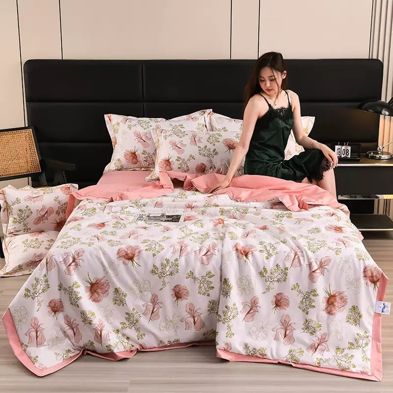 A Woman is Resting on Summer Cooling Comforter Set.