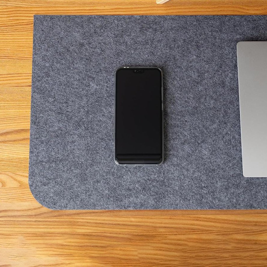 Mobile Phone is Placed at Table Mouse Pad.