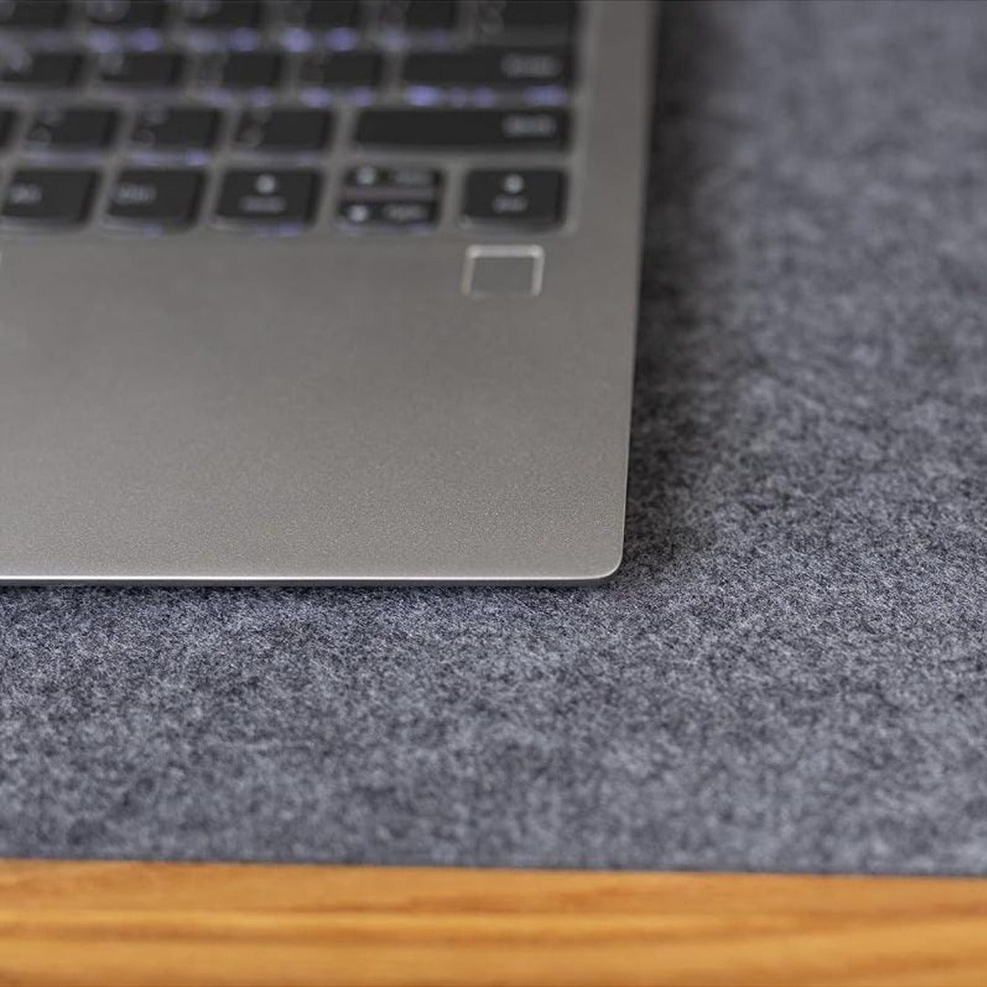 Table Mouse Pad in Grey Color Were Laptop is Placed.