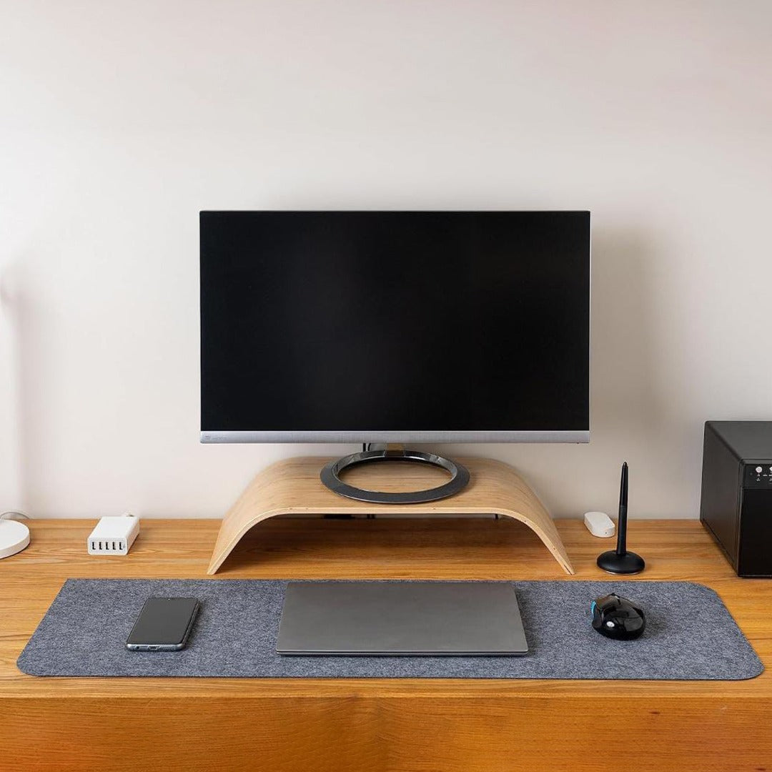 Table Mouse Pad in Grey Color Were Laptop and Mouse are Placed.