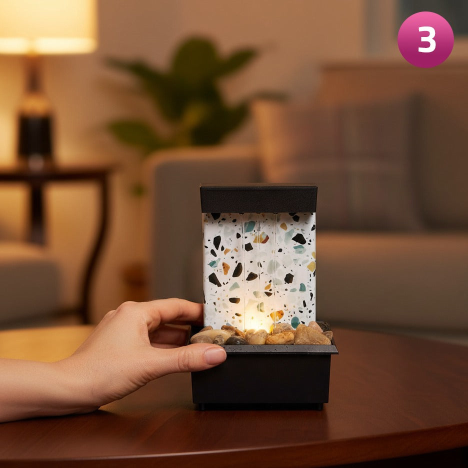 A Person is Operating Tabletop Water Fountain with Natural Stone.