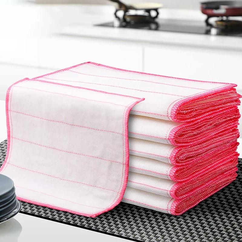 A stack of kitchen dishwashing cloths placed on the sheet
