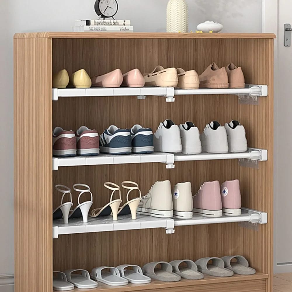 Expandable Closet Tension Shelf Divider with something arranged on it