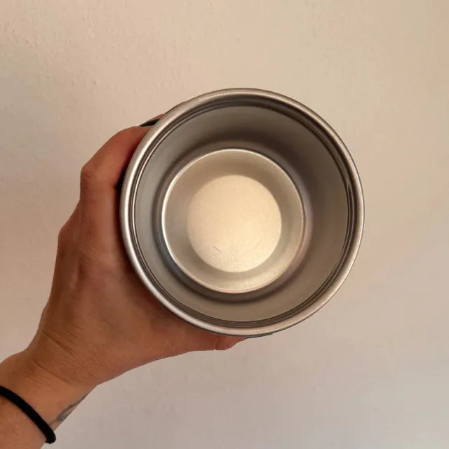 A Person is Holding Thermal Insulated Travel Flask.