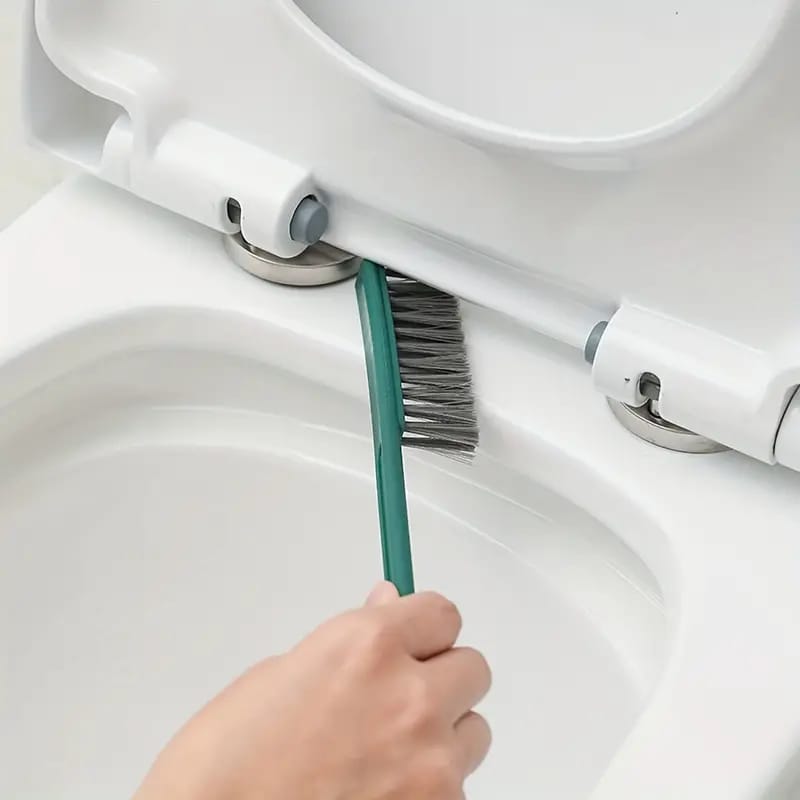 A Person is Cleaning Closet Using Brush From Toilet Brush and Holder Set.