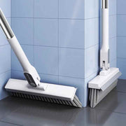 Toilet Floor Wiper Brush is Placed On the Side Of Bathroom.